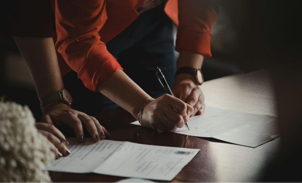 A person is manually confirming and verifying a COI