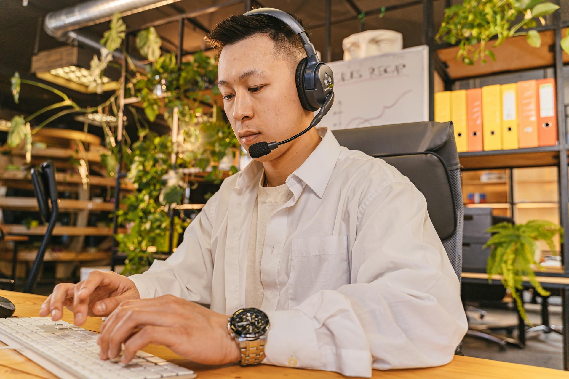 asian american male working at a white collared profession
