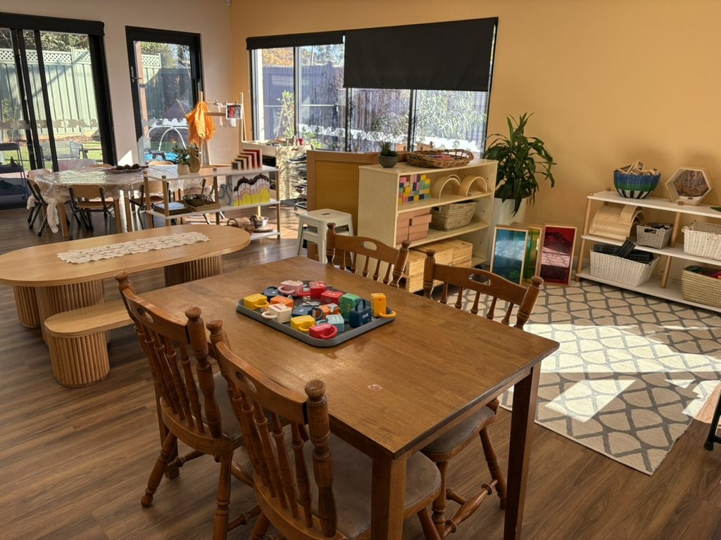 A sunny Kilmore room with a wooden dining table