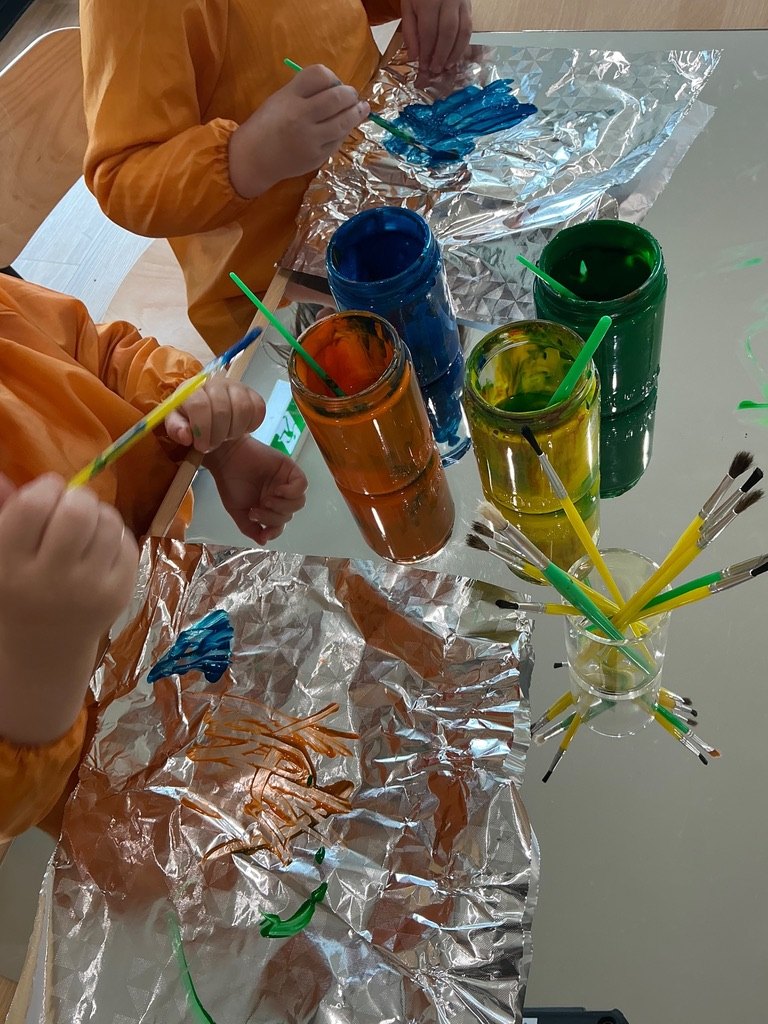 A child painting at Maples Kilmore
