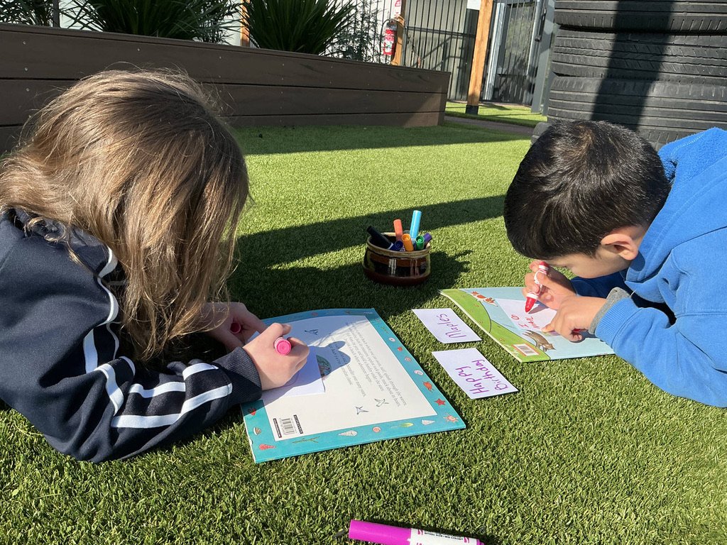 Drawing together on the grass