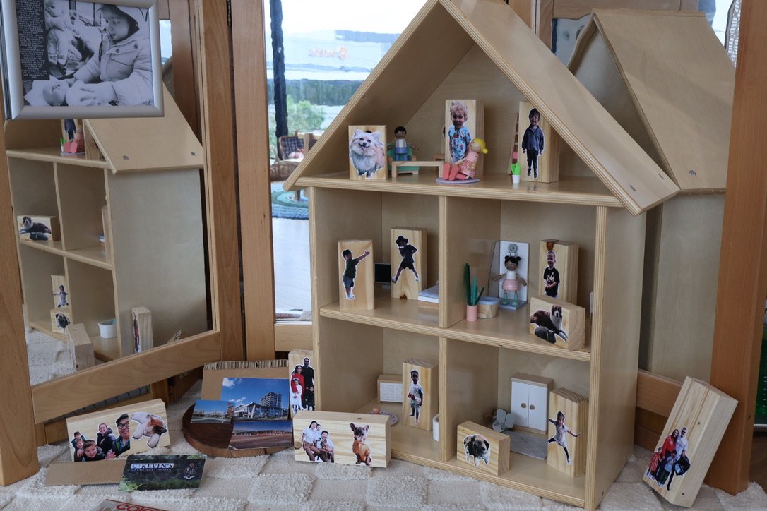 A family wall in the home corner