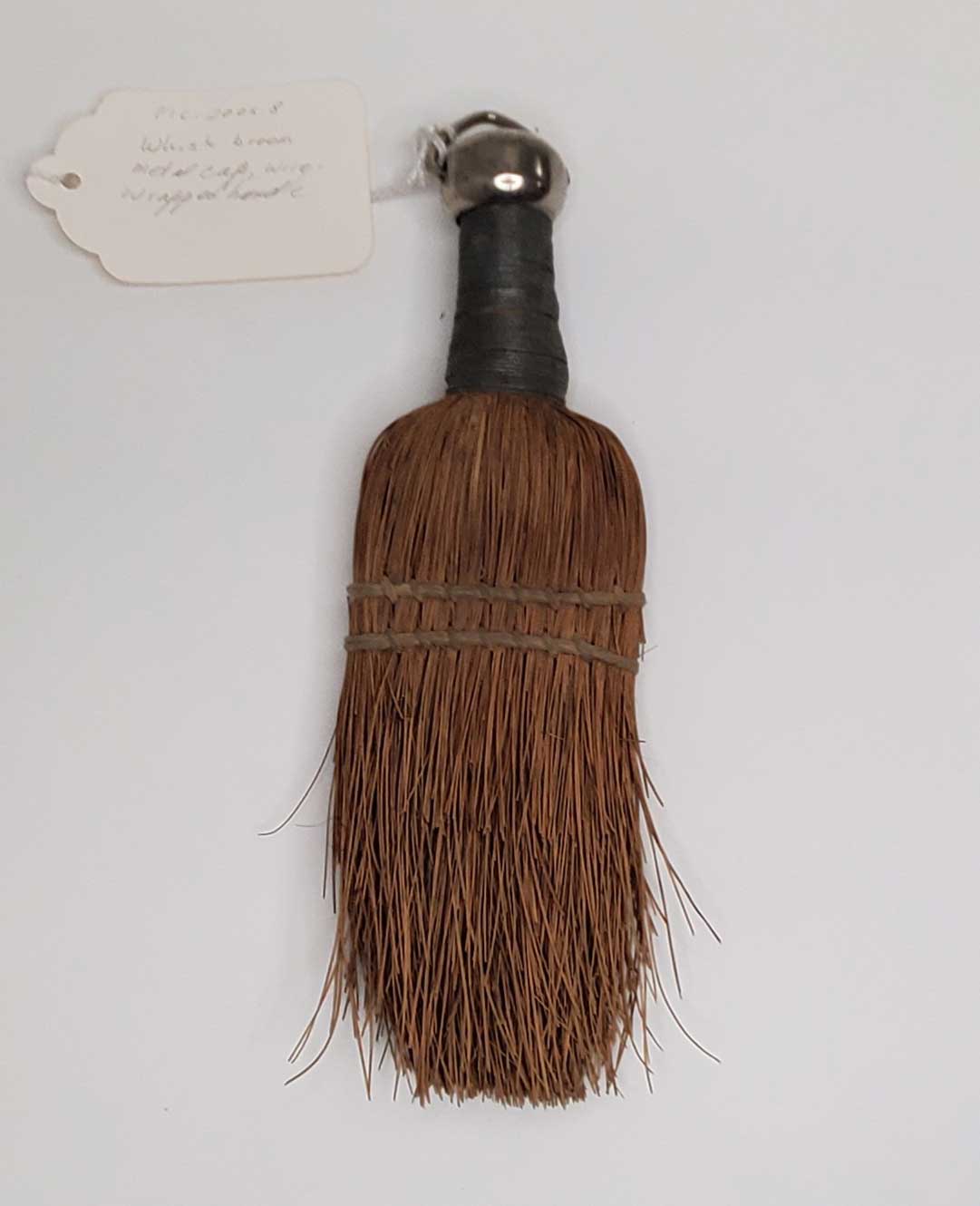 A photo of a vintage hand broom exhibit
