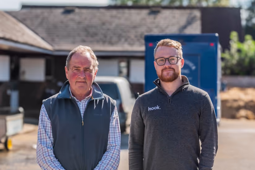 Hook Digital | Bespoke Marketing Solutions owner and client standing behind a friendly suburb