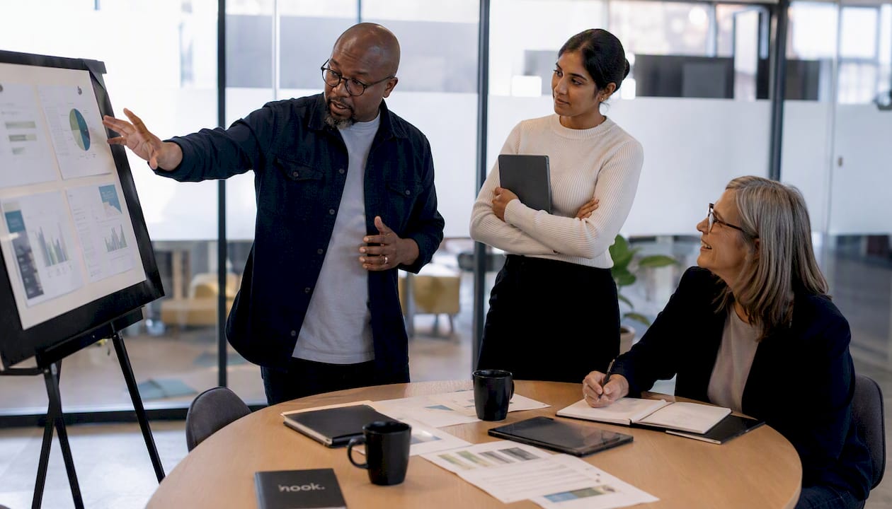 Professionals discussing web agency alternatives in meeting
