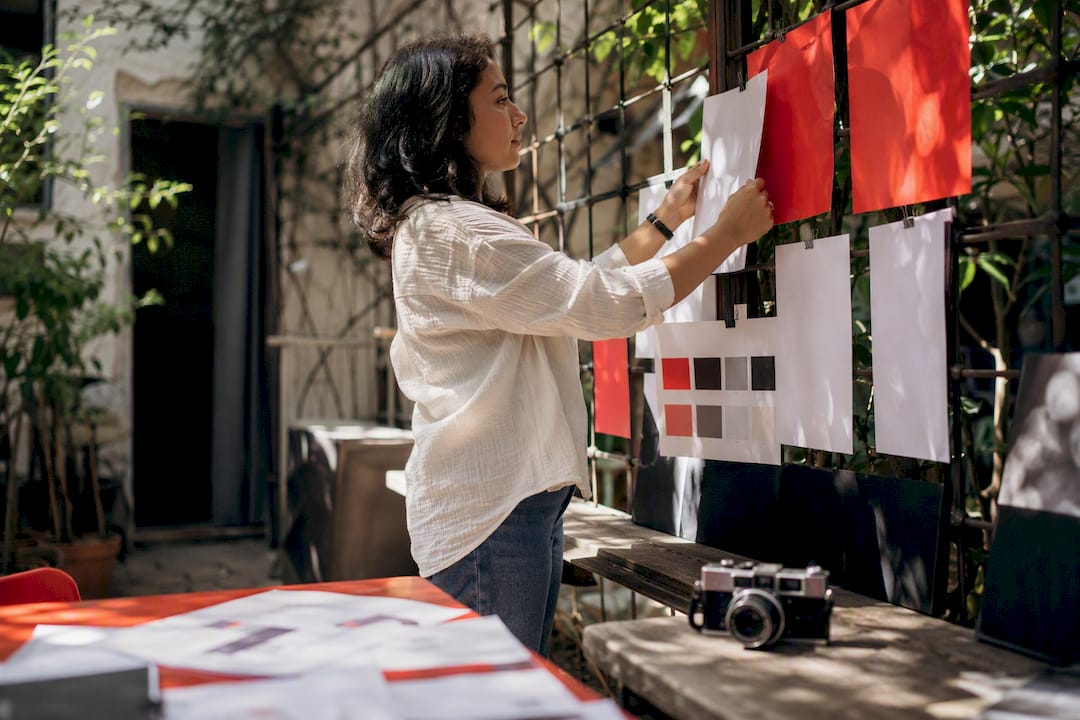 Marketer adjusting brand visual cues in studio