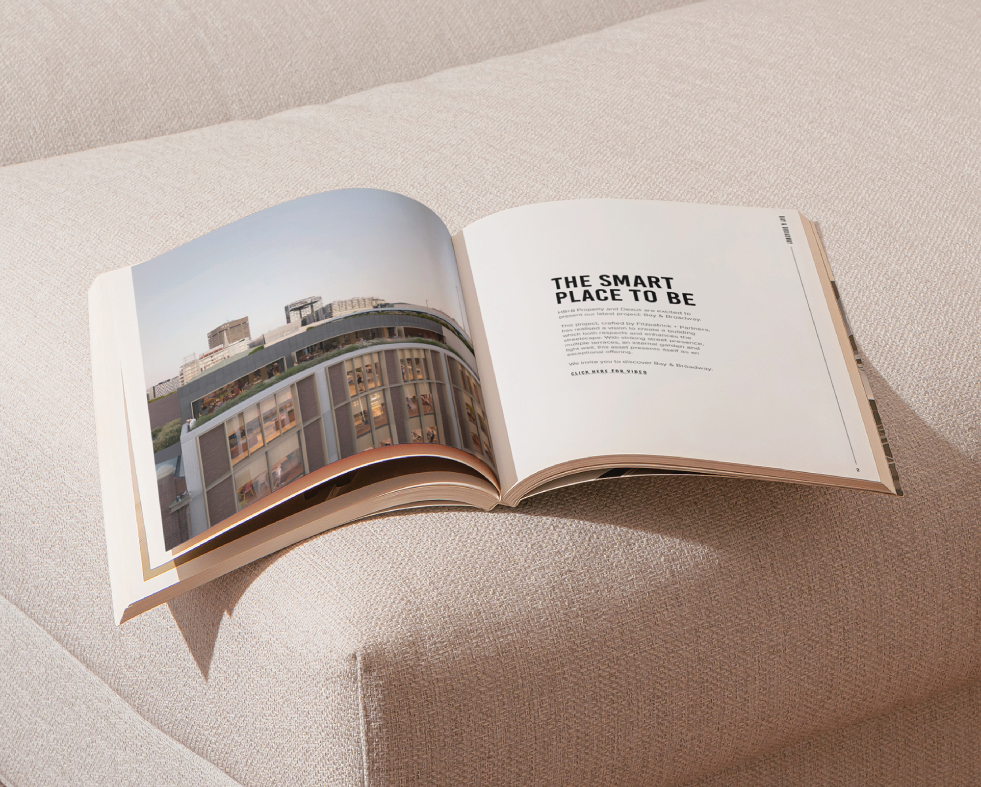 Bay & Broadway brochure open on sofa, featuring design render of modern office building at 86 Bay Street Ultimo Sydney.
