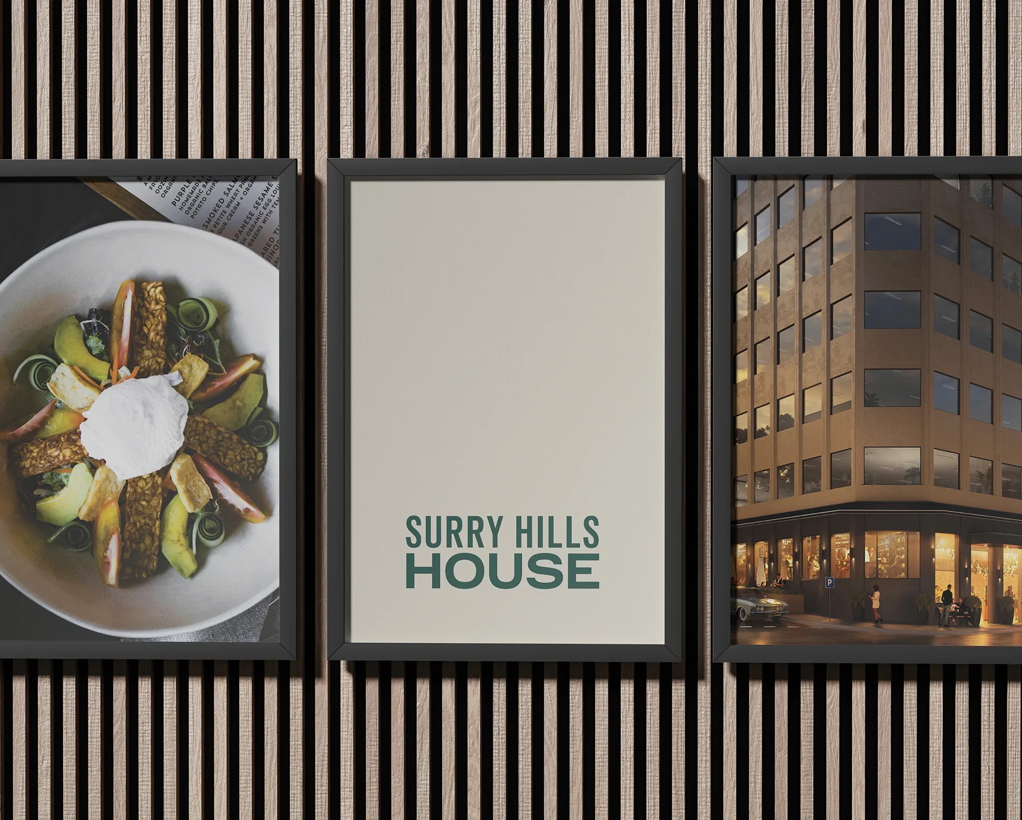Framed posters on wooden wall featuring Surry Hills House Australia branding, gourmet vegan dish, and exterior view of the building in Sydney.