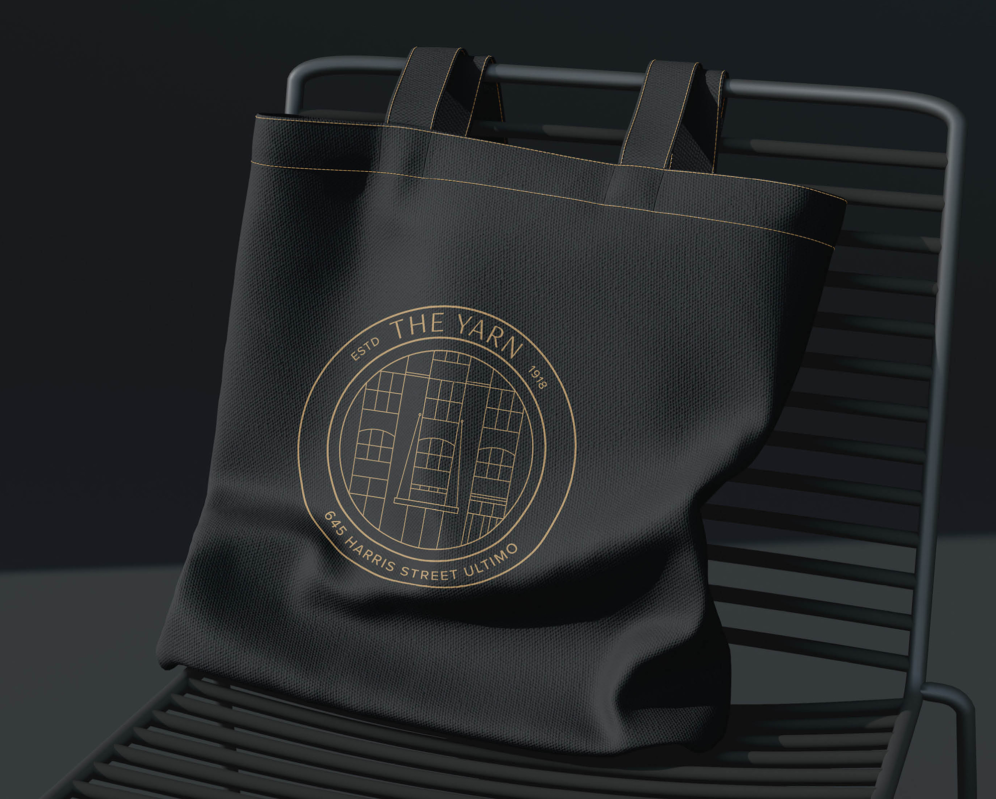 The Yarn Ultimo branding on black tote bag with gold heritage building logo for 645 Harris Street Sydney.