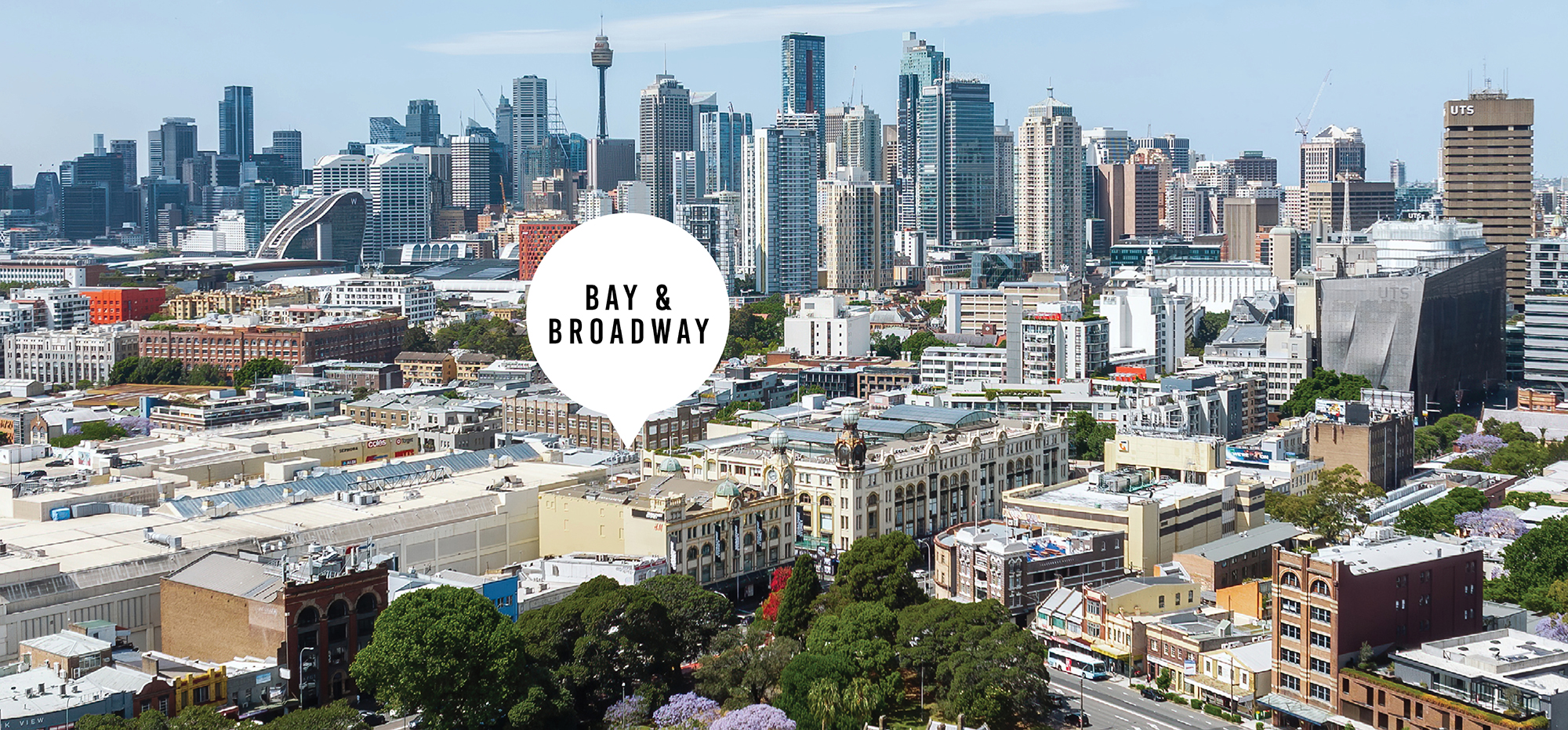 Bay & Broadway at 86 Bay Street Ultimo Sydney highlighted against panoramic view of Sydney CBD skyline with iconic landmarks.