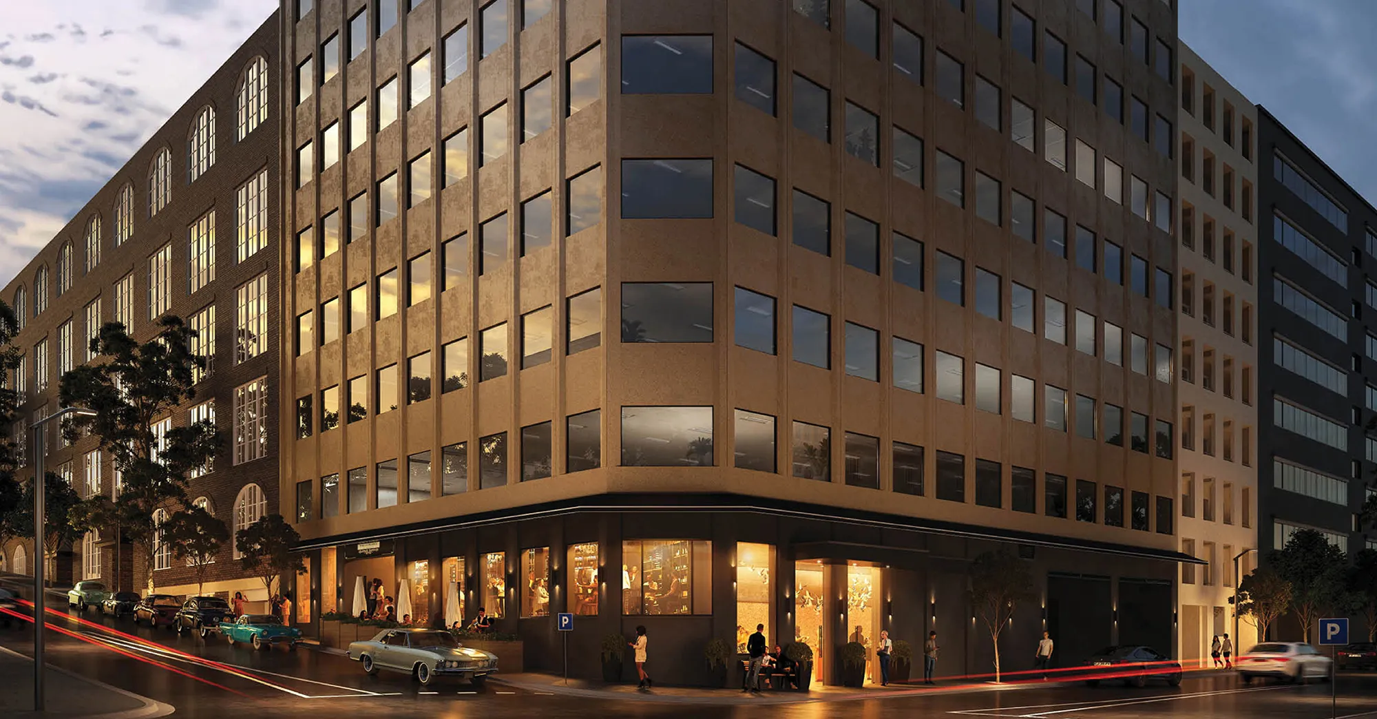 Exterior view of Surry Hills House Australia, modern office and dining space with large windows and vibrant street scene at dusk.