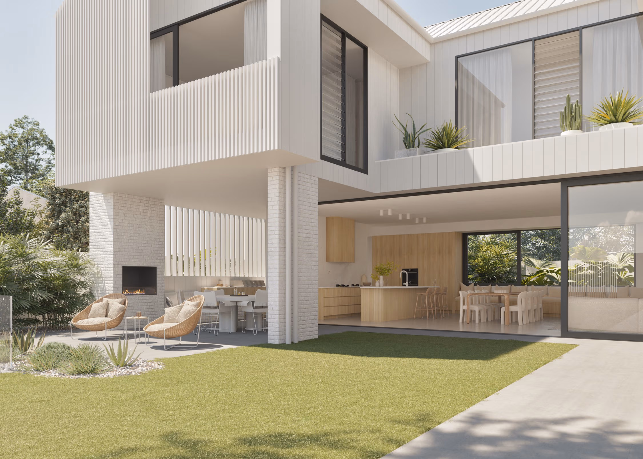 Outdoor living space featuring an alfresco dining area, built-in fireplace, and seamless flow to the modern kitchen in a bespoke Brisbane home.