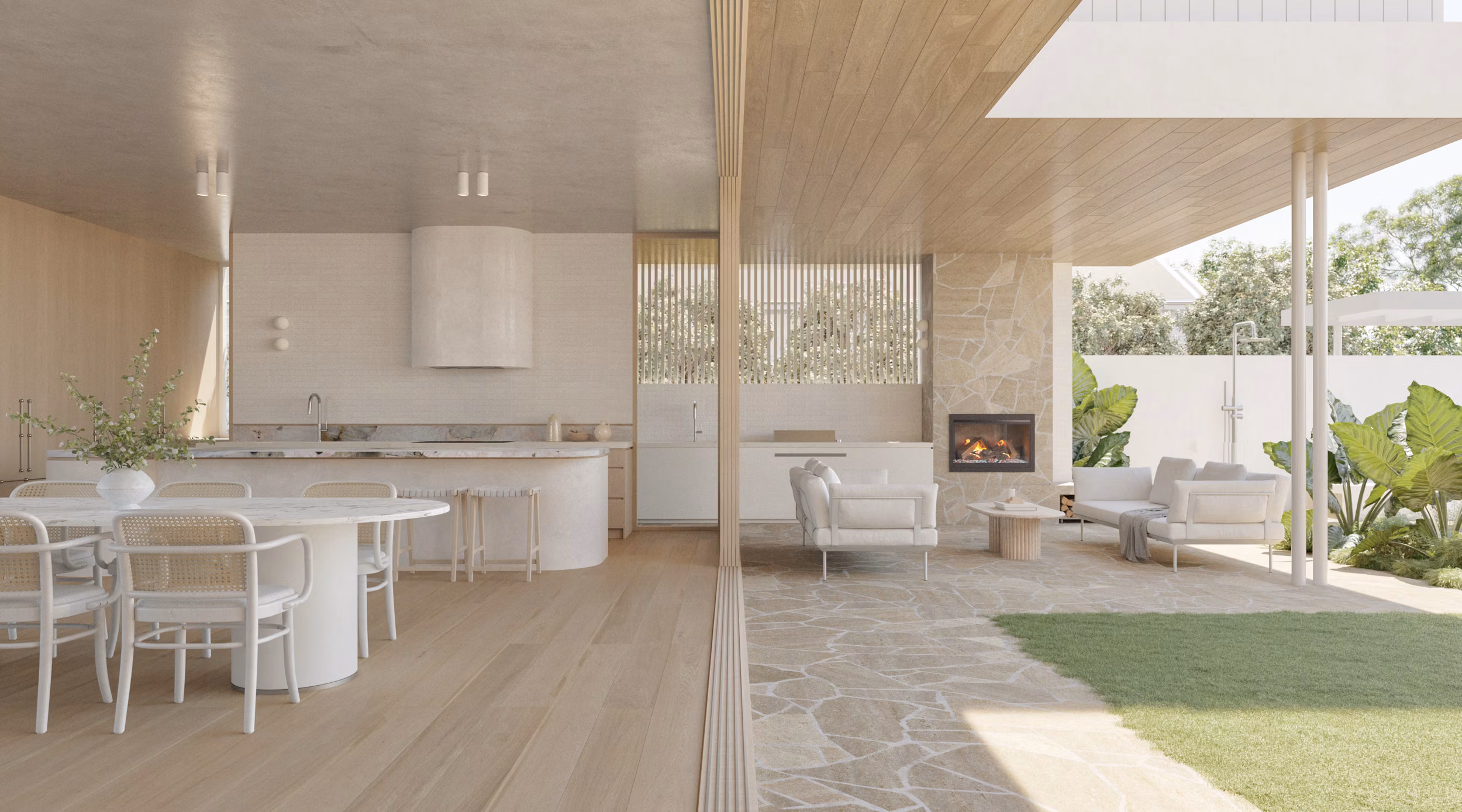 Open-plan living render of Dover featuring the rounded kitchen island, plaster range hood, marble benchtop, oval dining table with cane chairs, stone fireplace, covered alfresco, and tropical garden beyond