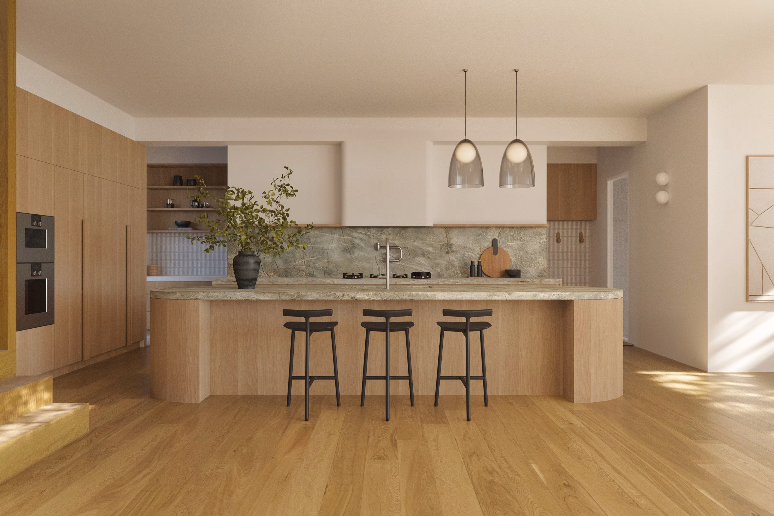 Warm oak kitchen with a curved stone-topped island, green marble splashback, black bar stools, and smoked glass pendant lights above
