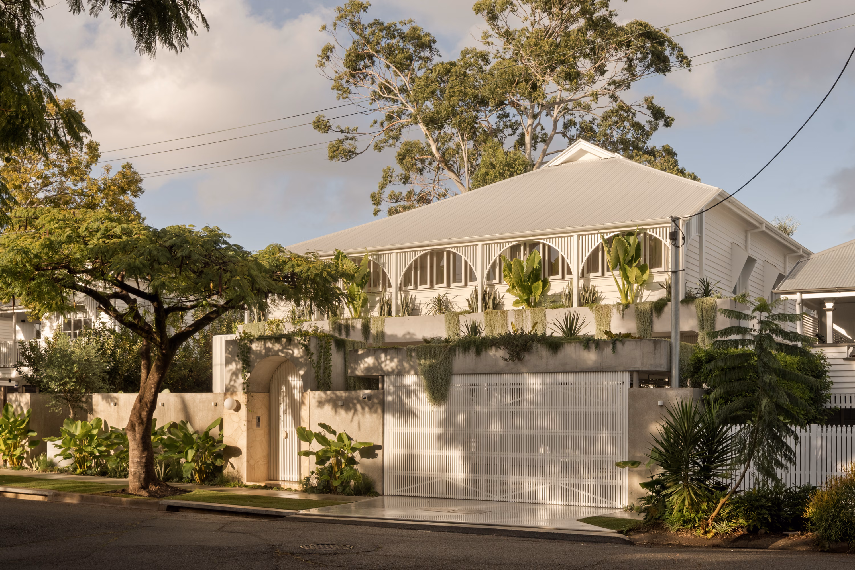 Spacious open-plan living room with seamless connection to the outdoors in a Brisbane bespoke home design.