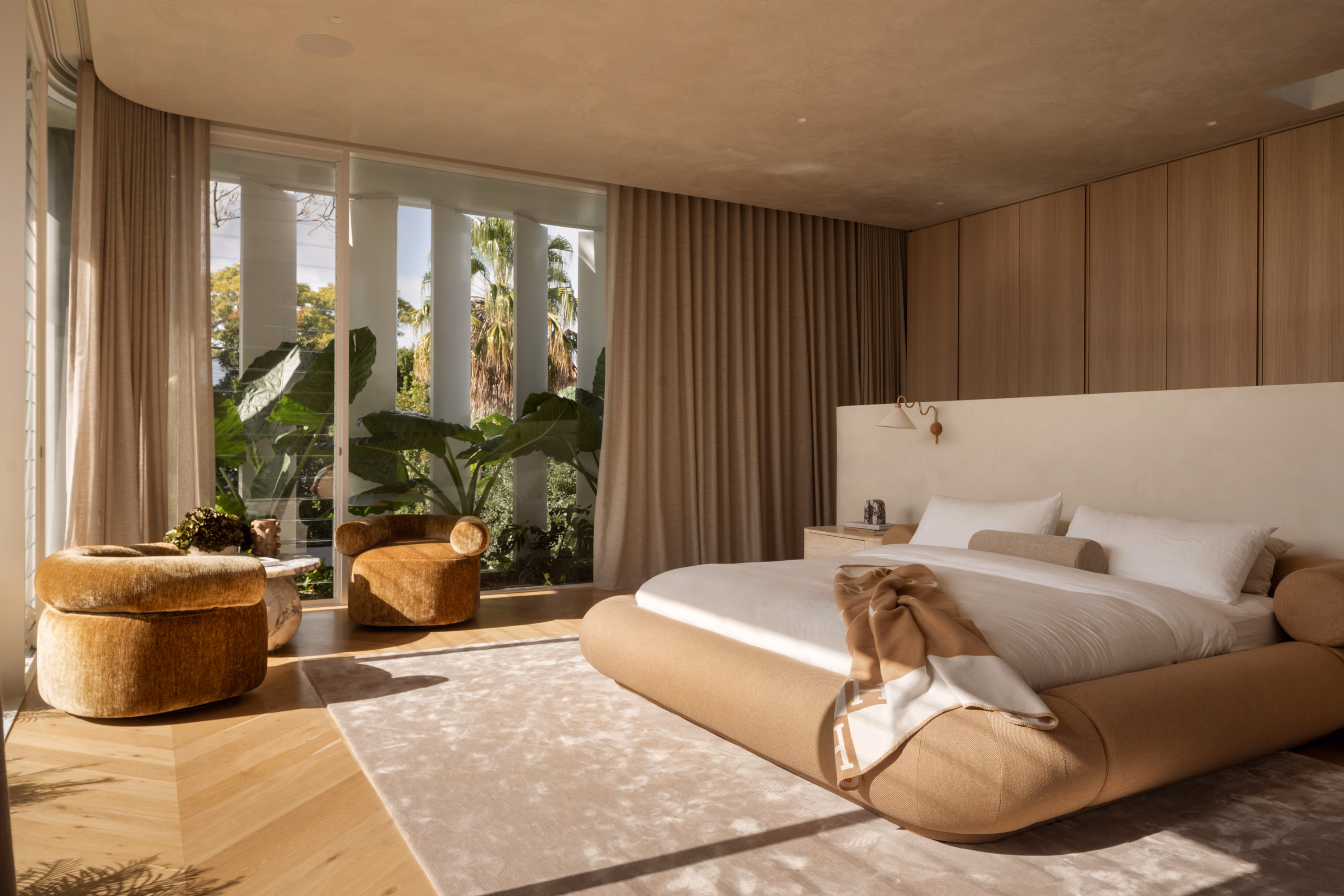 Wellness retreat bathroom with sauna and natural stone finishes in a Brisbane high-end residential project.