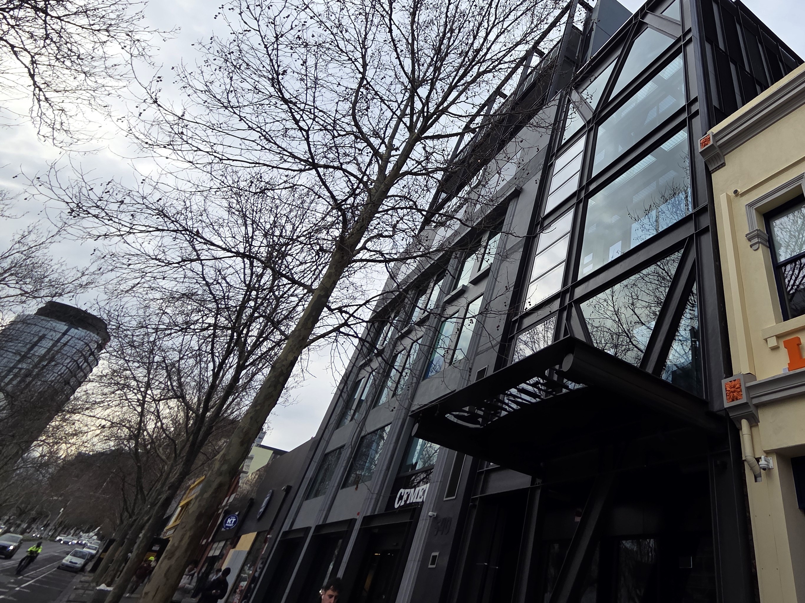 The external black and glass facade of the new sustainable commercial building on Leicester Street in Melbourne, VIC.