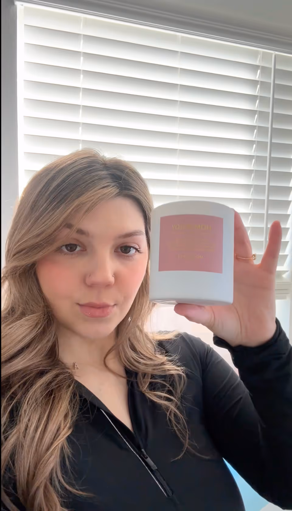 Vetted reviewer holding product for video review