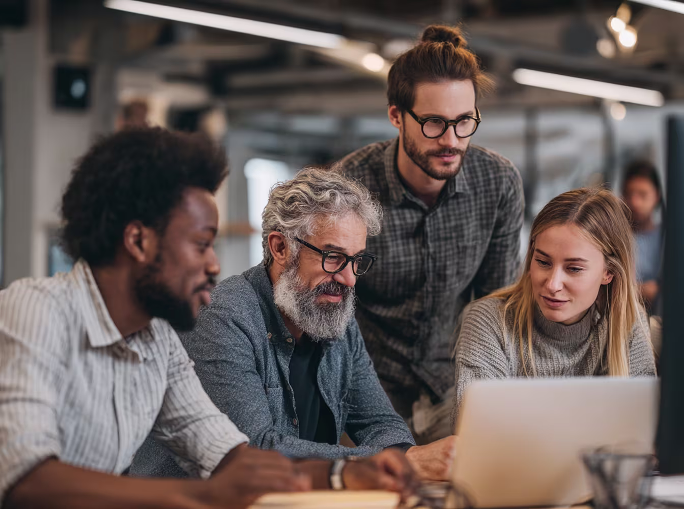 Diverse team discussing IT ticketing system