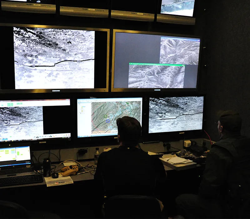 Operators monitoring wide-area motion imagery in an operations center
