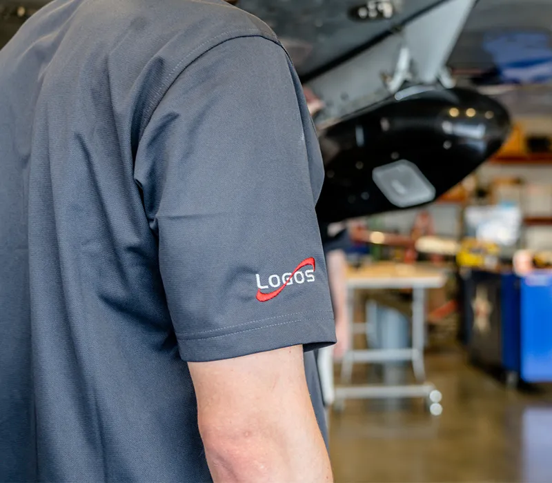 Logos engineer working beside a sensor pod