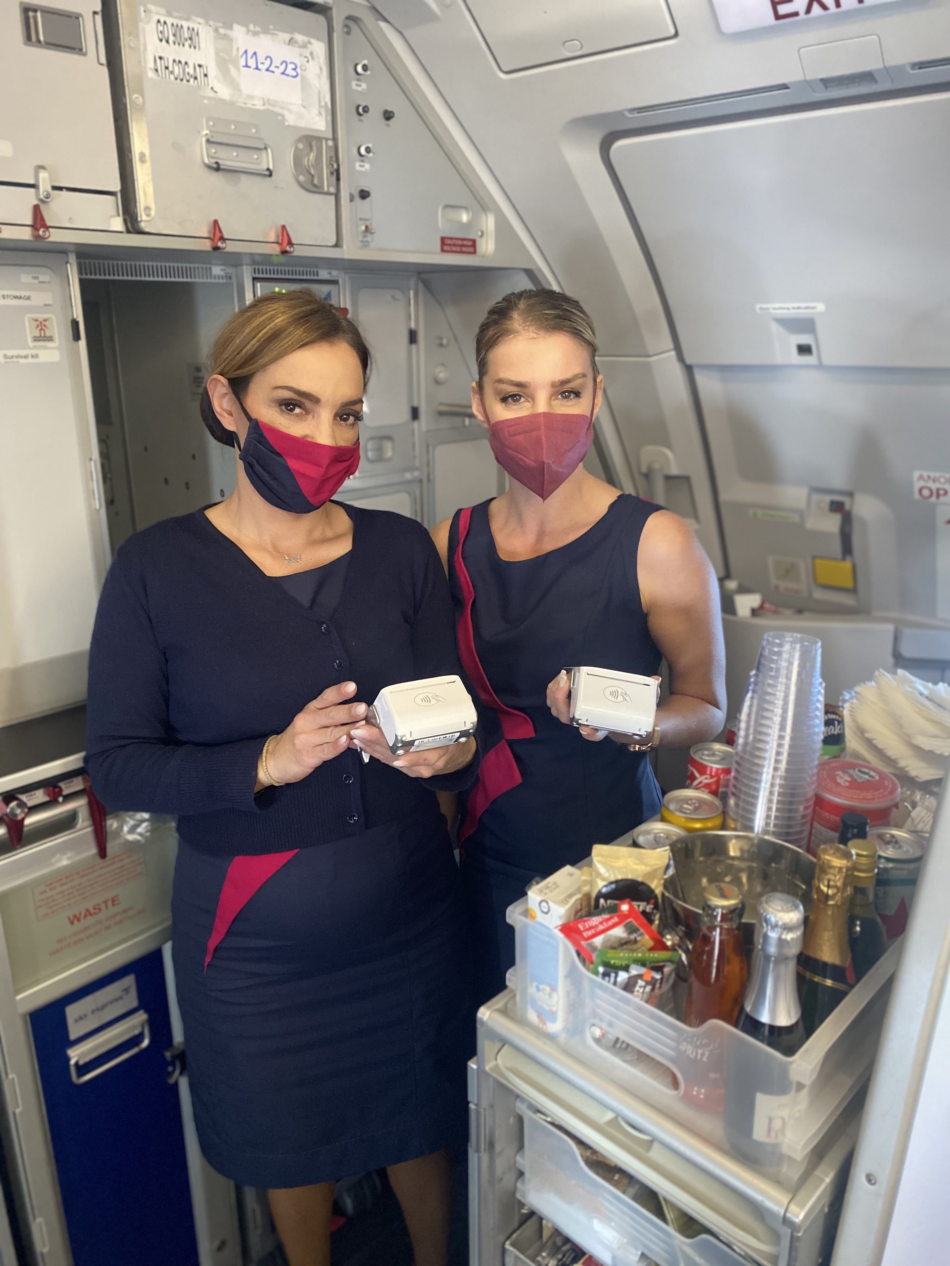 Two SKY Express cabin crew members in the galley