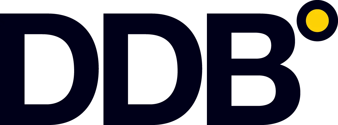 Logo with bold black letters 'DDB' followed by a solid yellow circle on a dark background.