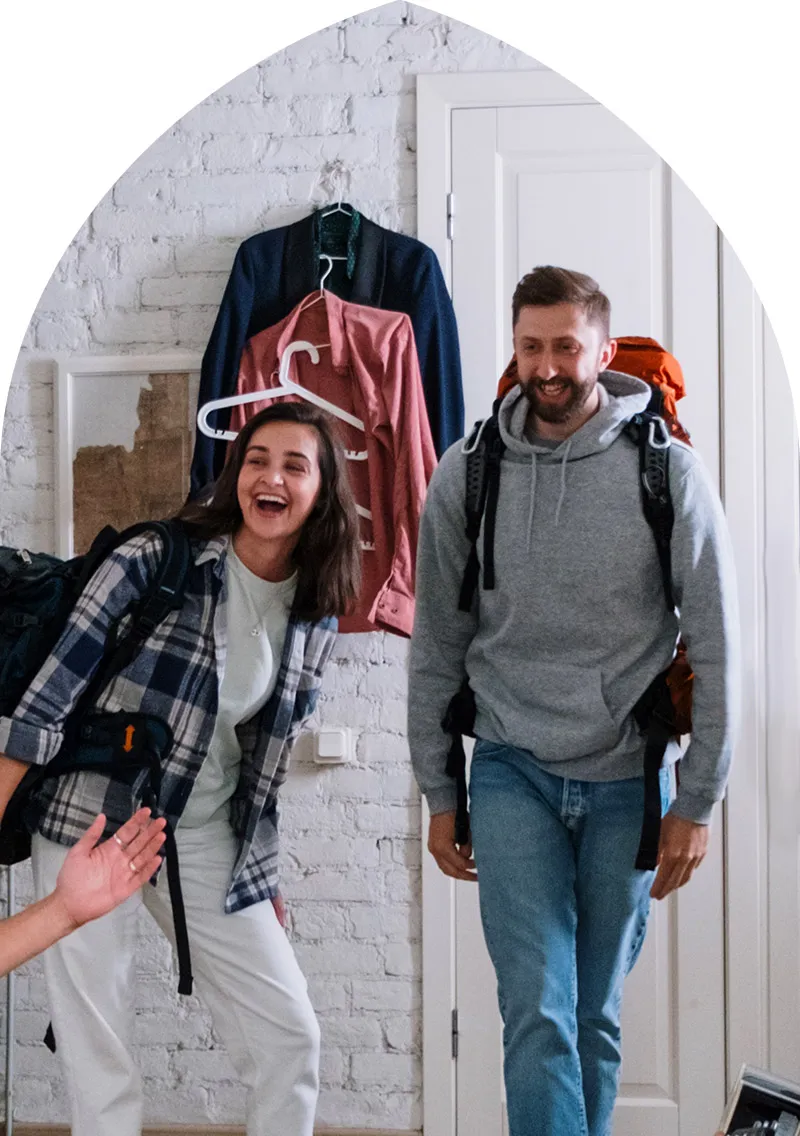 Travelers entering a home
