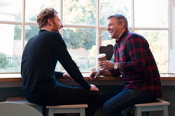 Men talking to each other.