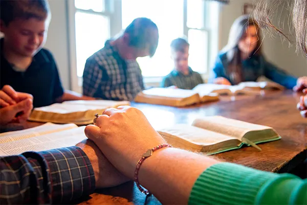 A family praying together.