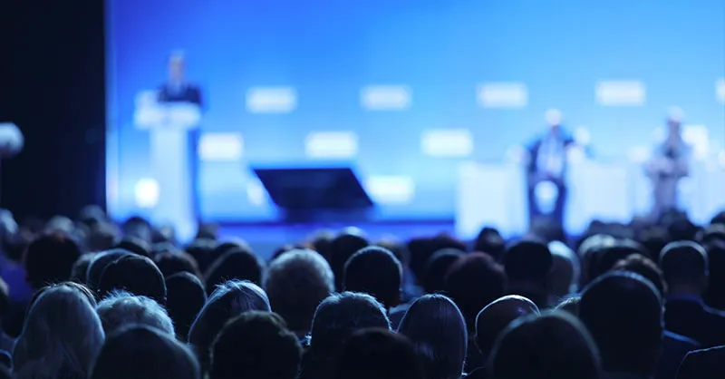 People listening to keynote talk