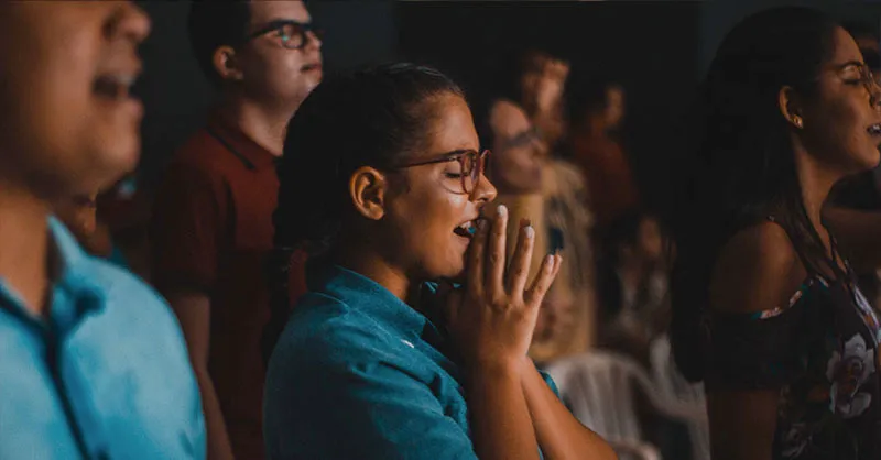 Young woman in prayer