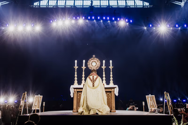 People worshipping Jesus in adoration