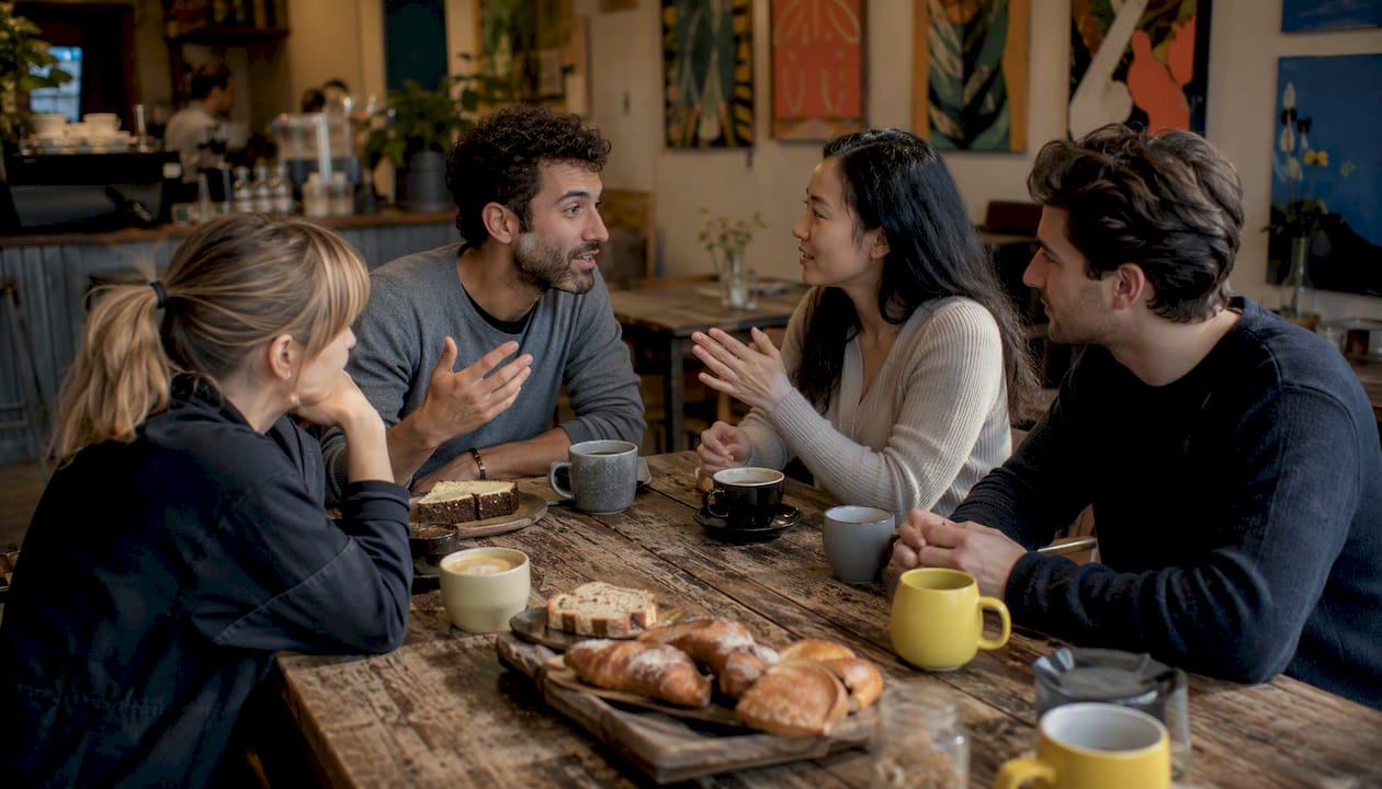 Small groups chatting in a language café
