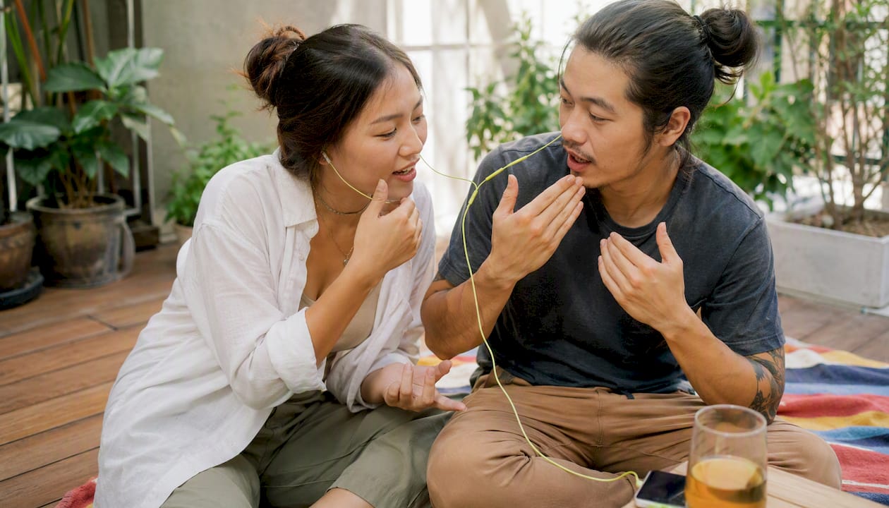 Two learners practicing pronunciation together