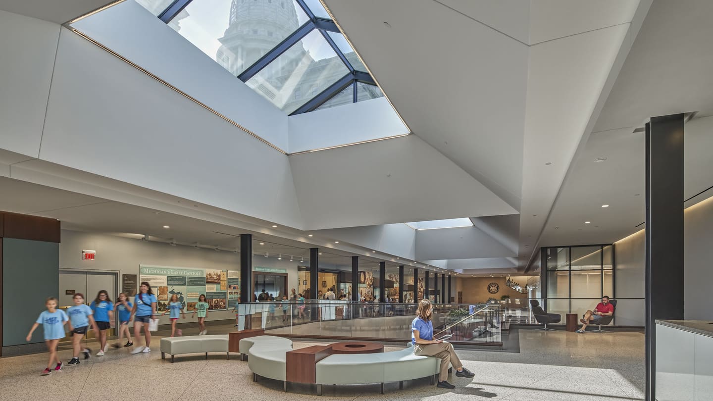 An interior photo looking up through a skylight at the Capitol dome.