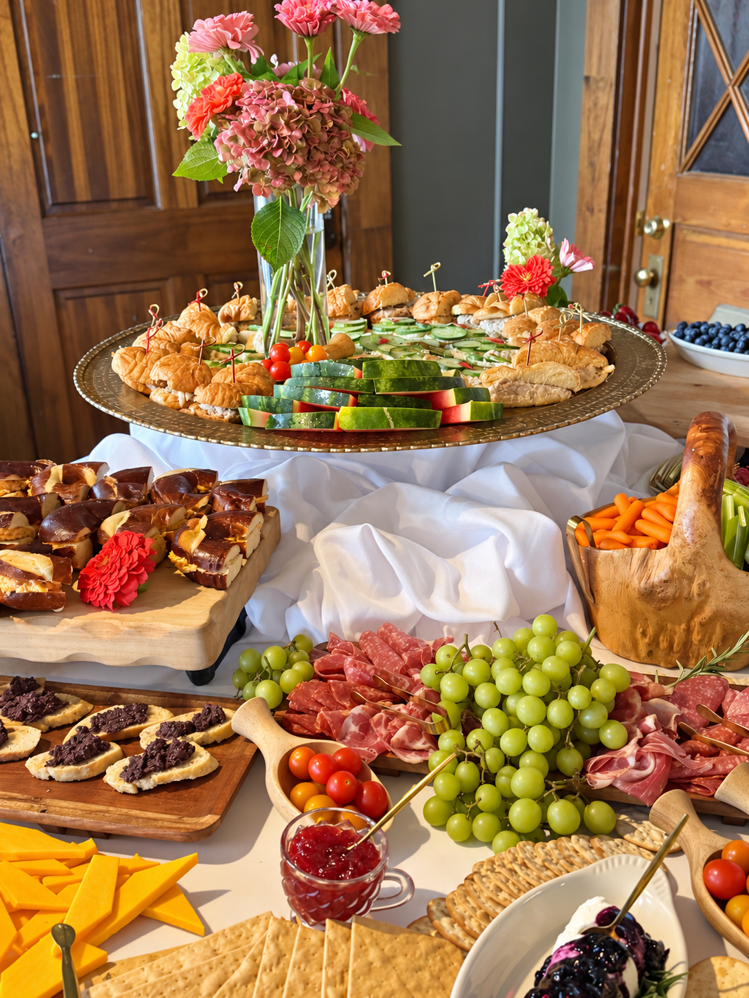 Fresh fruit, sandwiches, and grazing selections arranged for a private event