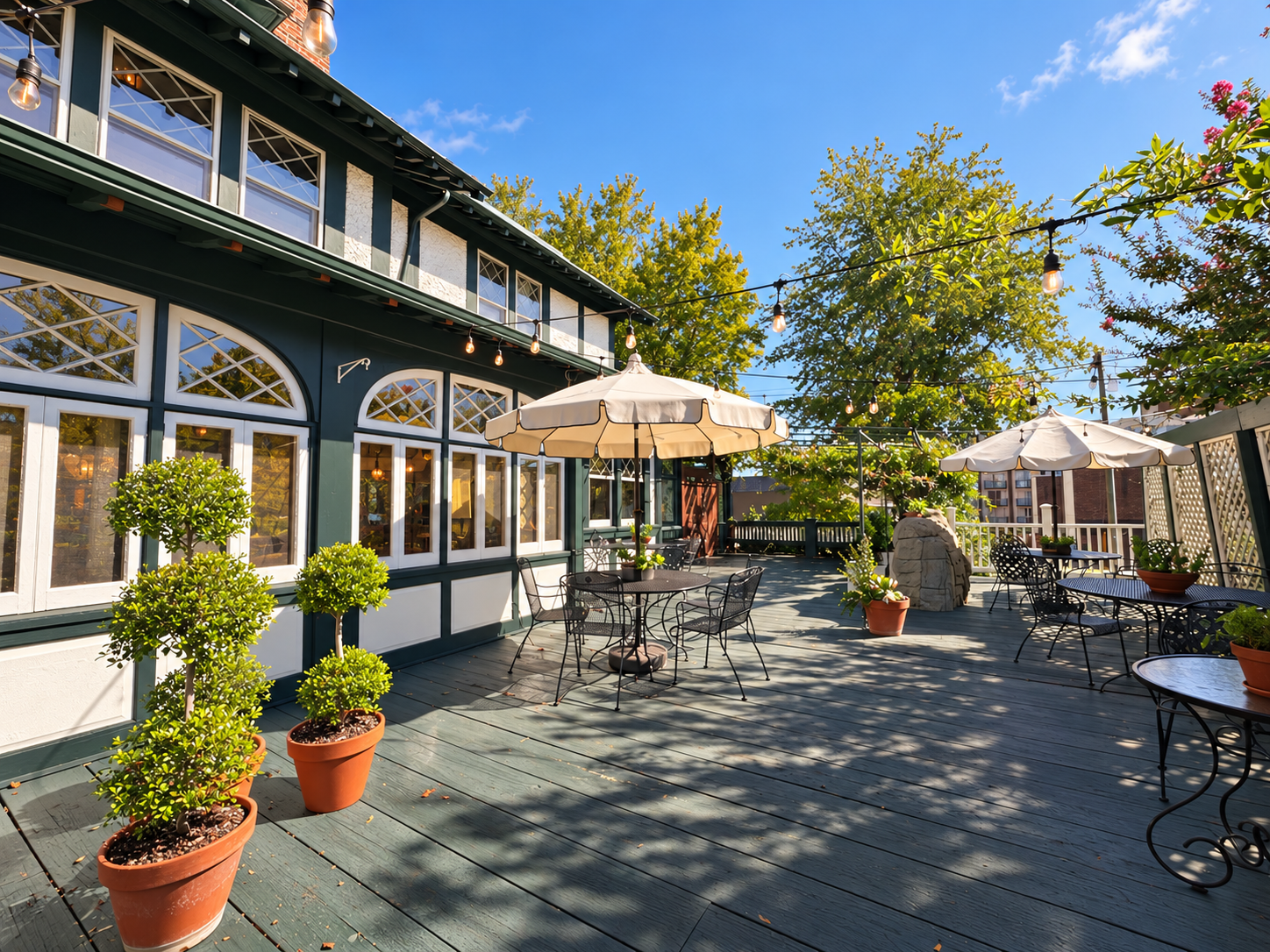 Courtyard with bistro tables and umbrellas at The Shaffner Inn