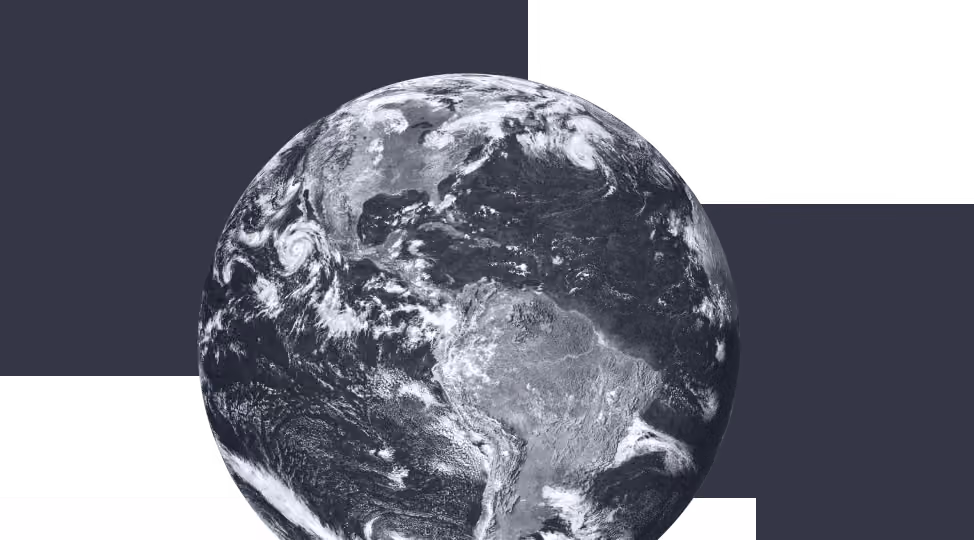 Black and white satellite view of Earth showing North and South America with cloud patterns.