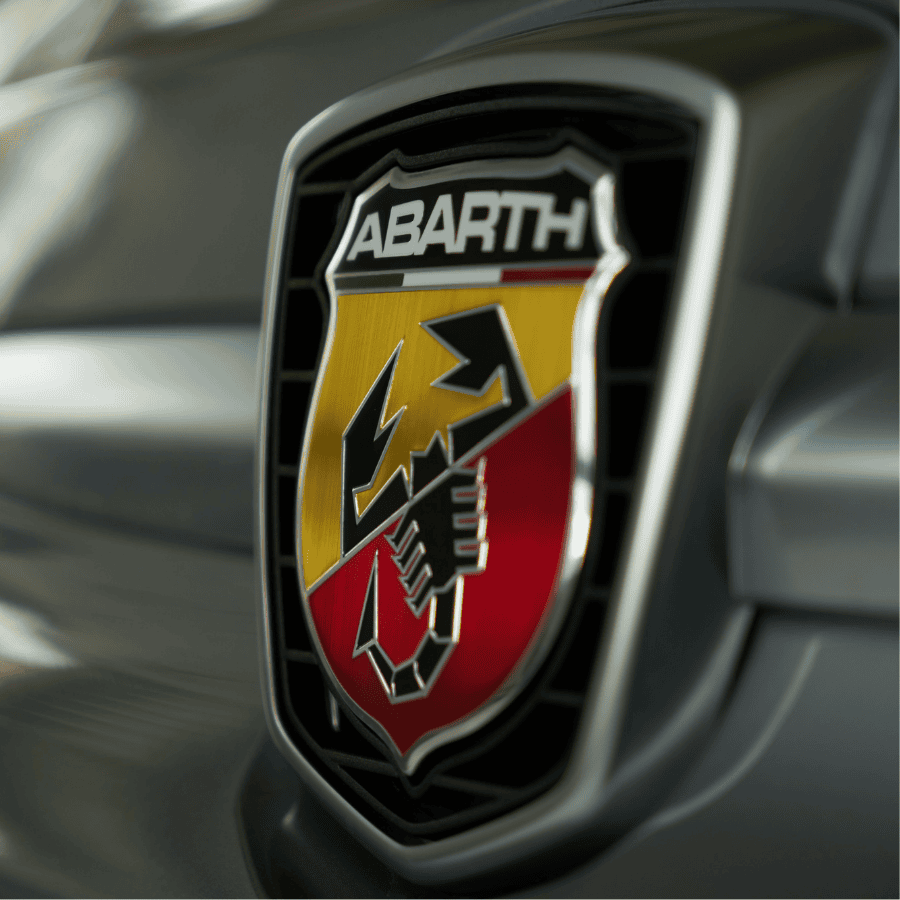 White pickup truck on dusty dirt road through arid rocky landscape