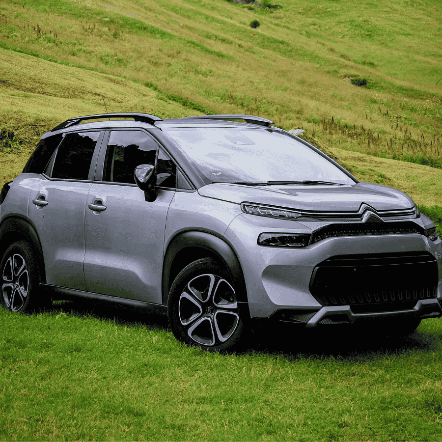 Hands on a Toyota steering wheel, close-up of vehicle interior