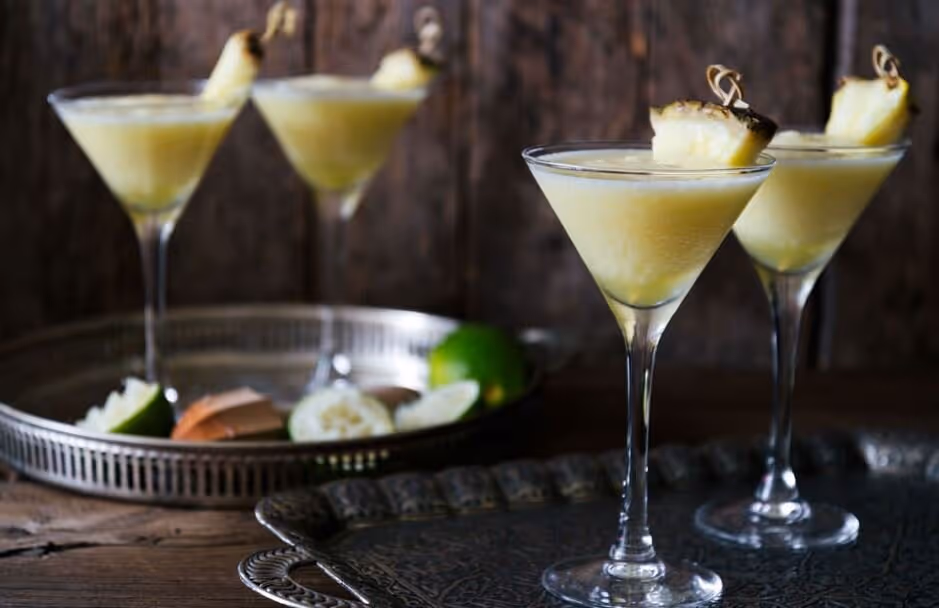 a group of glasses with a drink in it