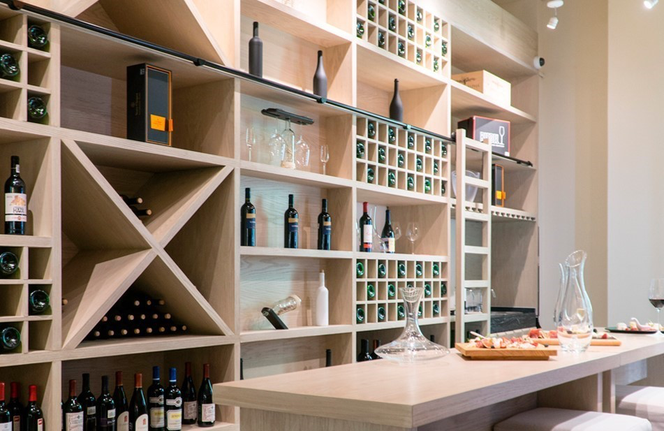 a wine cellar with shelves and wine bottles