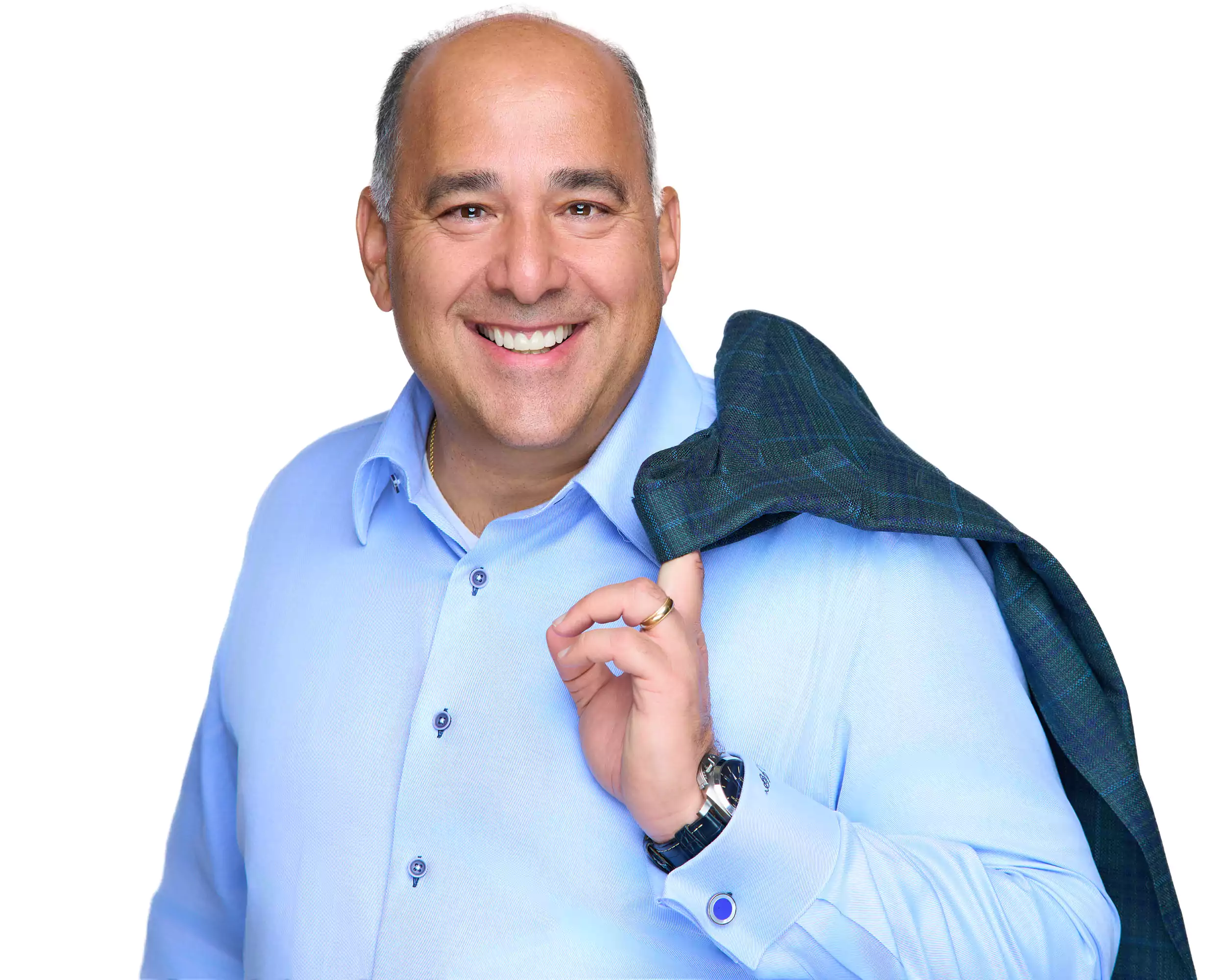 A man wearing a blue shirt and a plaid jacket.