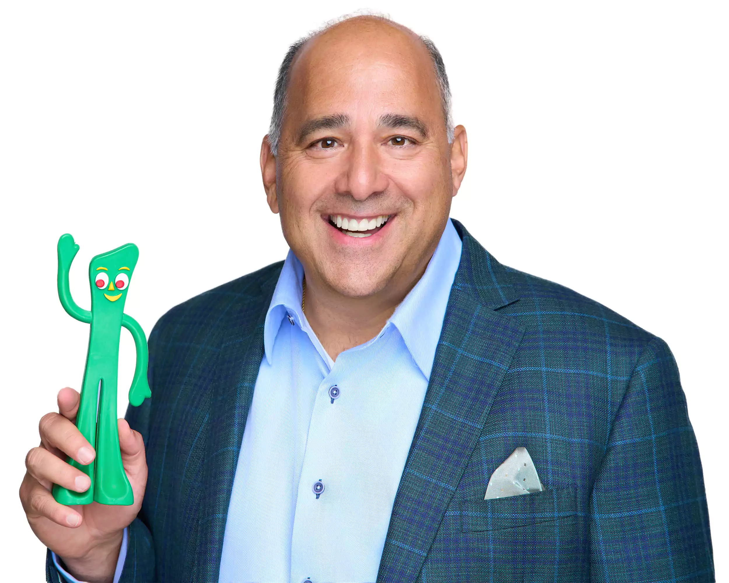 A man holding a green toy.