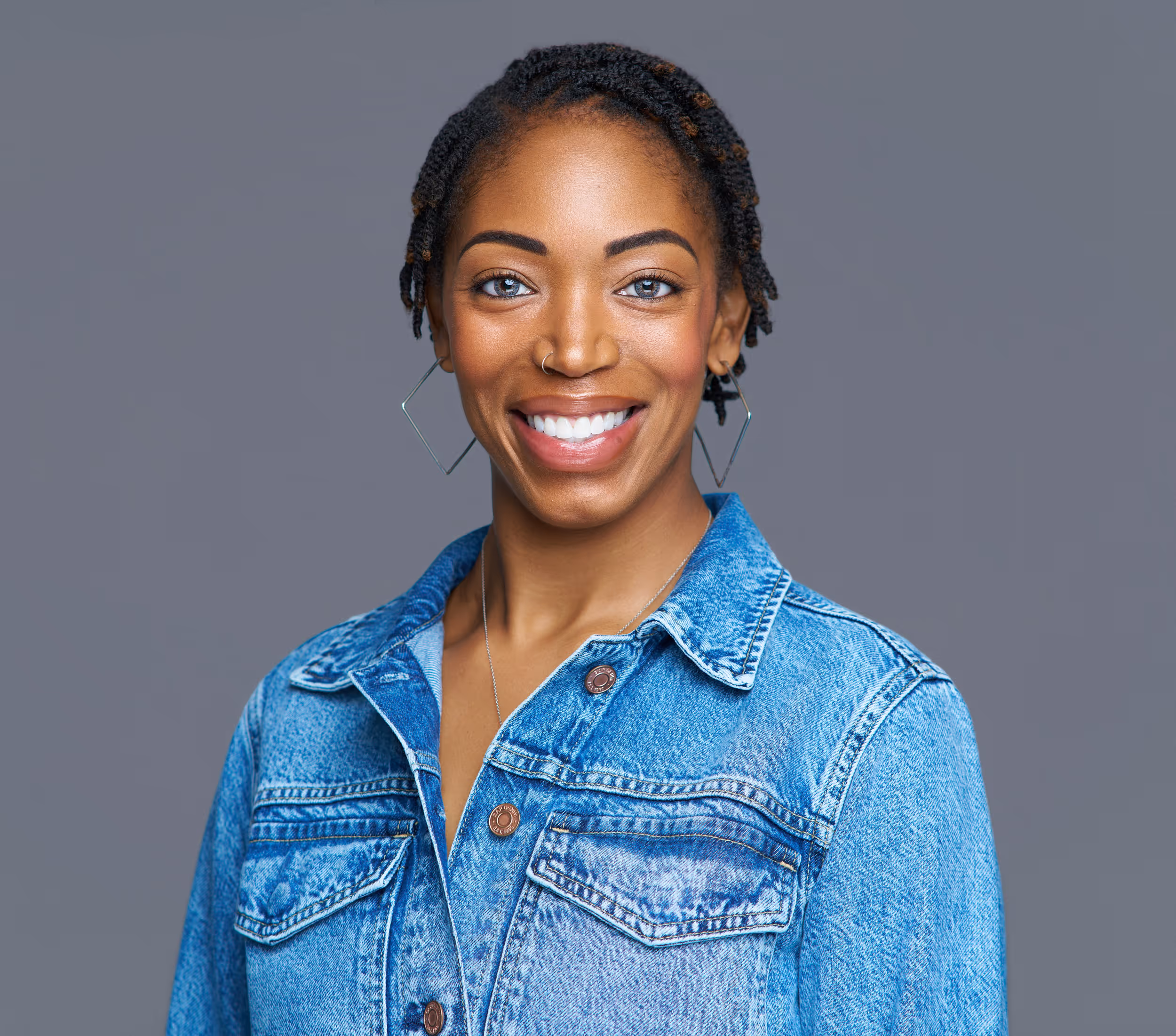 Corporate headshot of smiling woman with straight blonde hair for Experian. Captured during an on-location company headshot session of 146 employees in 1 day with 1 photographer.