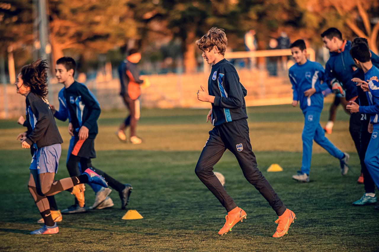 Youth soccer players in high-performance training drills at Osner’s FC Academy, developing agility, endurance, and technical skills.