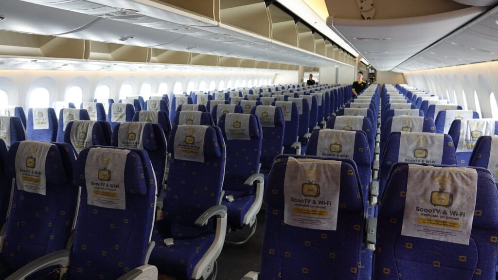a row of blue seats with white and yellow designs
