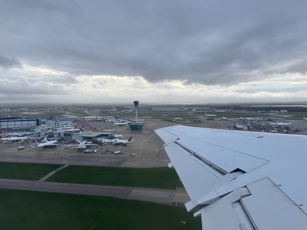 an airplane wing over an airport