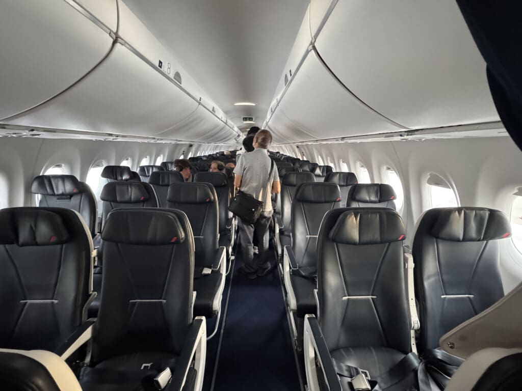 a man walking in an airplane